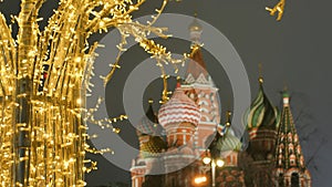 St. Basil`s Cathedral on Red Square against the backdrop of Christmas decorations.