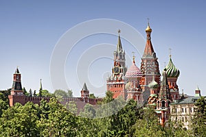 St. Basil`s Cathedral  and Spasskaya tower Moscow kremlin summer day cityscape
