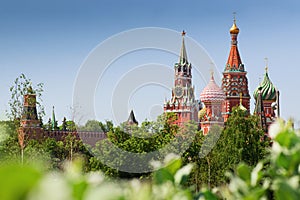 St. Basil`s Cathedral  and Spasskaya tower Moscow kremlin summer day cityscape