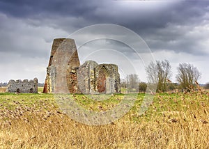 St Benet`s Abbey gatehouse and mill on the Norfolk Broads during a winter storm