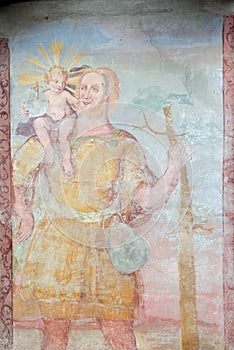 St Christopher, fresco on the facade of St George church in Luson, Italy