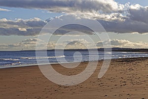 St Cyrus beach with the tide out, looking towards Montrose and Scurdie Ness Lighthouse