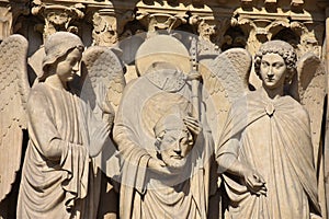 St. Denis on Facade of Notre Dame Cathedral in Paris France