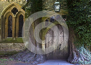 St Edward - Parish Church north door flanked by yew trees - Cotswolds - England, United Kingdom