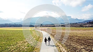 St Egyden - A couple walking around the fields