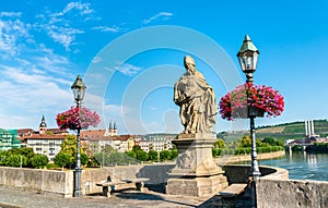 St. Frederick of Utrecht on Alte Mainbrucke, the old bridge across the Main river in Wurzburg, Germany photo