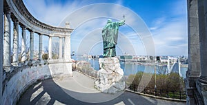 St. Gellert statue and skyline of Budapest with blue sky and moving clouds, Hungary photo