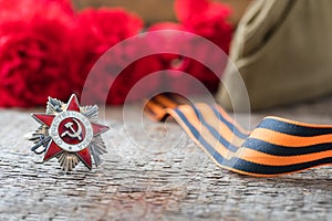 St. George ribbon and red carnation, may 9 Victory Day concept, symbol of the Second World war