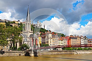 St. Georges church and bridge over Saone river in Lyon, France