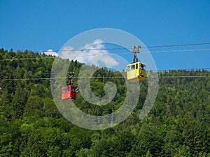 St Gilgen/Austria - June 2 2019: red and yellow tourist cable cars in austria