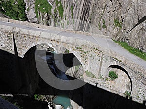 St. Gotthard Teufelsbruecke, alpine Devil`s road bridge over Reuss river near Andermatt town in Switzerland