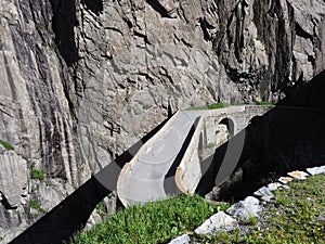 St. Gotthard Teufelsbruecke, alpine Devil`s road bridge over Reuss river near Andermatt town in Switzerland