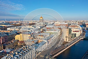 St. Isaac`s Cathedral in the distance above the rooftops of the city of Saint-Petersburg, view heights of the Moika River and the