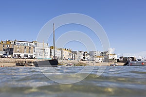 St Ives Harbour, harbour beach and town from the sea.