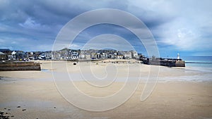 St Ives Harbour at low tide Cornwall with threatening sky