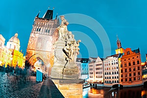 St. Ivo Statue on Charles Bridge at night. Prague, Czech Republic photo