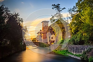 St. Jean Pied de Port, France - The Sunset View of the Pingrim Bridge and the Town Gate, the Starting Point of the Way of St James