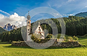 St. John church in front of the Odle mountains, Funes Valley, Dolomites, Italy