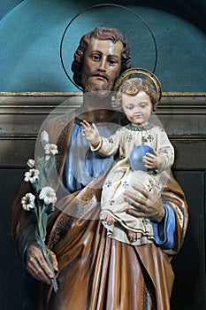 St. Joseph holding the child Jesus, statue on the altar of St. Joseph in the church of Holy Three Kings in Karlovac, Croatia