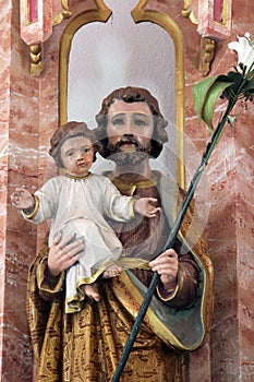 St Joseph holding child Jesus, statue on the High altar in the parish church of St Luke in Lukac, Croatia