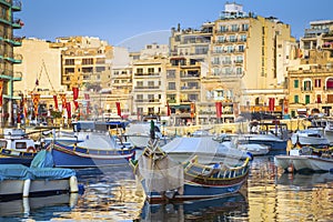 St.Julian`s, Malta - Traditional Luzzu fishing boats at Spinola