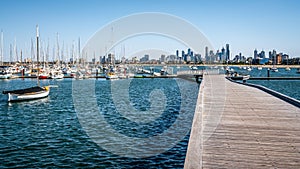 St Kilda marina full of boats view from the pier and Melbourne Skyline in background in Saint Kilda Melbourne Australia