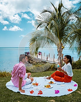 St Lucia caribbean, couple on vacation at Saint Lucia, men and woman in luxury resort during lunch with a look at the photo