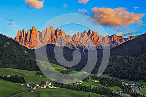 St. Magdalena village with magical Dolomites Odle mountain ridge in golden hour