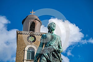 St. Marien Church with Asmussen Woldsen Statue in front, Husum, low angle horizontal shot