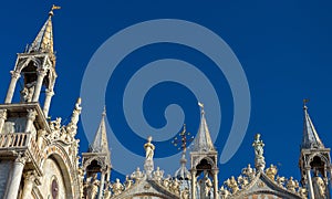 St Mark`s Basilica or San Marco, detail of facade top on blue sky background, Venice, Italy