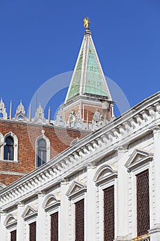 St Mark`s Campanile Campanile di San Marco and Doge`s Palace Palazzo Ducale on a background of blue sky, Venice, Italy