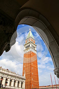 St Mark`s Campanile seen through Palazzo Ducale gallery at Piazz