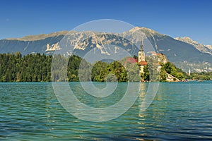 St Martin church on island,castle and mountains in background,Bled Lake,Slovenia,Europe