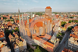 St. Mary's Basilica Beautiful panoramic architecture of old town in Gdansk, Poland at sunrise. Aerial view drone pov