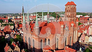 St. Mary's Basilica Beautiful panoramic architecture of old town in Gdansk, Poland at sunrise. Aerial view drone pov