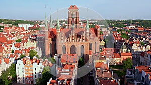 St. Mary's Basilica Beautiful panoramic architecture of old town in Gdansk, Poland at sunrise. Aerial view drone pov