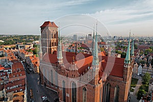 St. Mary's Basilica Beautiful panoramic architecture of old town in Gdansk, Poland at sunrise. Aerial view drone pov