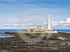 St Mary\'s Island and lighthouse at Whitley Bay, North Tyneside with causeway visible at low tide, UK