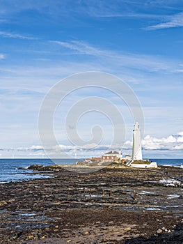 St Mary\'s Island and lighthouse at Whitley Bay, North Tyneside with causeway visible at low tide, UK