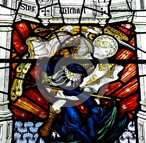 St. Michael conquers the devil & x28;stained glass& x29; photo