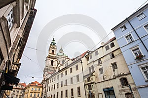 St Nicholas Church, also called Kostel Svateho Mikulase, in Prague, Czech Republic, with its dome seen from Karmelitska street photo