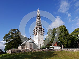 St. Nicholas church, with tower in the scaffolding, in Kose