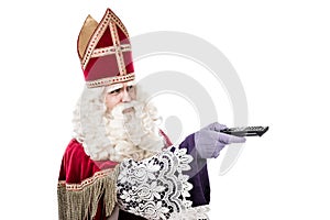 St. Nicholas holding remote on white background