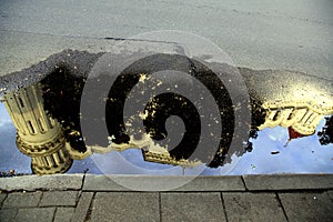 St. Nicholas Orthodox Church reflection in the water puddle after the rain, Vilnius, Lithuania photo