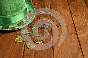 St. Patrick concept. Green hat and lucky coins.