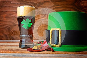 St.Patrick concept with green leprechaun hat, beer and gold