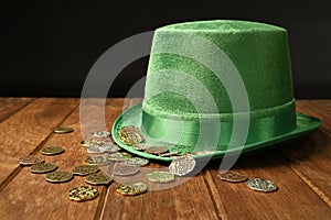 St. Patrick concept. Lucky coins on a hat.