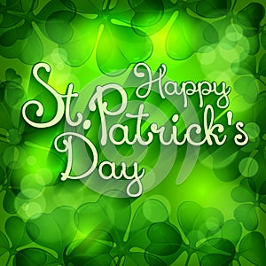 St. Patrick lettering on green leaves background