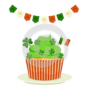 St. Patrick`s cupcake with shamrock clover and the flag of Ireland. Flat cartoon vector illustration isolated on a white