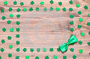 St Patrick`s Day background, green quatrefoils on the wooden background and free space for text